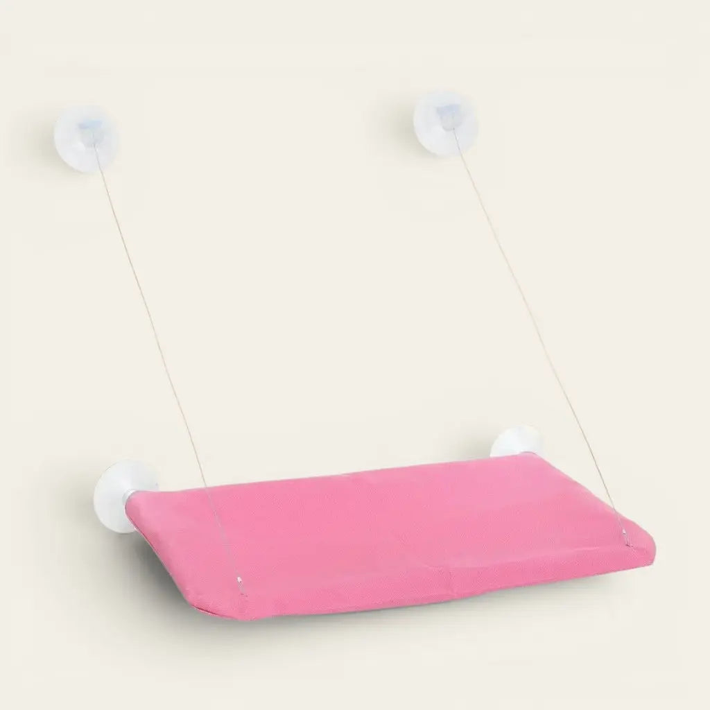 Hamac pour chat à ventouse rose pour fenêtre permettant à votre chat de se détendre tout en observant l’extérieur.